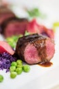 Lamb chops with pea and purple potatoes Royalty Free Stock Photo