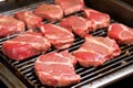 lamb chops probed for doneness on a flat iron grill Royalty Free Stock Photo