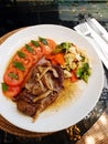 Lamb chops with vegetables - outdoor dining Royalty Free Stock Photo