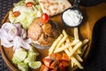 Lamb Gyros kebab served with bread,french fries and salad Royalty Free Stock Photo