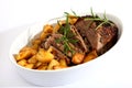 Lamb joint and roast potatoes Royalty Free Stock Photo