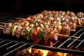 lamb kebab skewers arranged on a hot grill