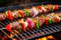 lamb kebabs on grill with red, green bell peppers, onions