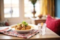 lamb korma on a low table with cushions, traditional eating setting