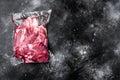 Lamb meat pack ready for cooking, on black dark stone table background, top view flat lay, with copy space for text Royalty Free Stock Photo