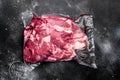 Lamb meat raw pack, on black dark stone table background, top view flat lay, with copy space for text Royalty Free Stock Photo