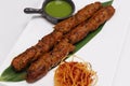 lamb or mutton seekh kebab (mince mutton meat skewer) served with mint chutney, indian street food