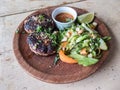 Lamb patties and salad on a rustic dish