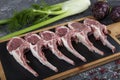 Lamb ribs cooking. Raw rack of lamb with spices and condiments. Uncooked mutton rack of lamb studio shot Royalty Free Stock Photo