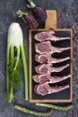 Lamb ribs cooking. Raw rack of lamb with spices and condiments. Uncooked mutton rack of lamb studio shot Royalty Free Stock Photo