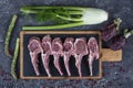 Lamb ribs cooking. Raw rack of lamb with spices and condiments. Uncooked mutton rack of lamb studio shot Royalty Free Stock Photo