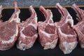 Lamb ribs cooking. Raw rack of lamb with spices and condiments. Uncooked mutton rack of lamb studio shot Royalty Free Stock Photo