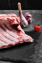 Lamb ribs fresh meat, with eco-friendly packaging. Food Delivery Concept. copy space, dark background Royalty Free Stock Photo