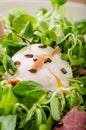 Lamb's lettuce salad with poached egg and nuts