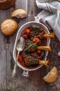 Lamb shank braised in tomato sauce, top view Royalty Free Stock Photo