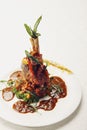 Lamb shank with special sauce. Conceptual image Royalty Free Stock Photo