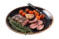 Lamb sirloin fillet meat in plate with grilled tomato, mutton grilled loin steak. Isolated on white background. Top view Royalty Free Stock Photo