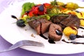Lamb steak with potato, vegetable and black sauce Royalty Free Stock Photo