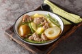 Lamb stew with pears, potatoes, green beans in a spicy sauce close-up in a bowl. horizontal Royalty Free Stock Photo