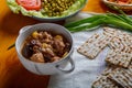 Lamb stewed with potatoes in spices and sauce next to flatbread iftar meal