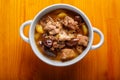 Lamb stewed with potatoes in spices and sauce in a soup bowl on the table