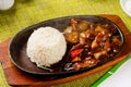 Lamb with vegetables and rice in a hot pan, Chinese traditional food Royalty Free Stock Photo