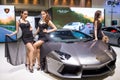 Lamborghini Aventador with pretty girls on display