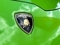Lamborghini logo with a bull on the hood of a green luxury sports car Royalty Free Stock Photo