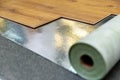 Laminate floor installation in a room on foil underlay Royalty Free Stock Photo