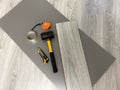 Laminate floor laying tool, underlay, board, hammer, tape measure, adhesive tape and utility knife