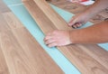 Laminate flooring installation. Installing wooden Laminate Flooring Royalty Free Stock Photo