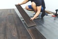 Laminate flooring - worker installing new floor Royalty Free Stock Photo