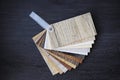 Laminated chipboards. Samples of laminate and vinyl floor tile on Royalty Free Stock Photo