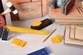 Laminated flooring and assorted tools for placement on gray table