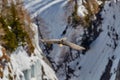 Lammergeier or Bearded Vulture, , flying bird above rock forest mountain. Rare bird, fly with snow, animal in stone habitat, Royalty Free Stock Photo