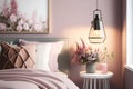 Lamp above table with flowers in pink pastel bedroom interior with window above bed. Real photo Royalty Free Stock Photo