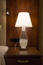 A lamp on a bedside cabinet Royalty Free Stock Photo