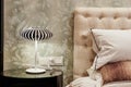 Lamp on bedside table in bedroom Royalty Free Stock Photo