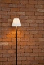 Lamp brick against wall