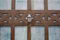 Lamp on a brown lath wall Royalty Free Stock Photo