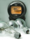 Lamp bulb and electricity supply meter Royalty Free Stock Photo