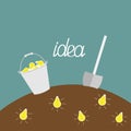 Lamp bulb underground. Shovel and bucket. Dig the idea concept. Royalty Free Stock Photo