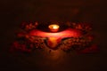 A lamp burning on rangoli design, shape of lamp, made by colors