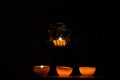 Lamp, candle shining in the darkness. Challis flame. Artistic composition. Lighting Royalty Free Stock Photo