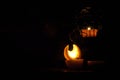 Lamp, candle shining in the darkness. Challis flame. Artistic composition. Royalty Free Stock Photo