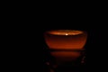 Lamp, candle shining in the darkness. Challis flame. Artistic composition.