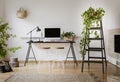 Lamp and desktop computer on black desk in workspace interior wi Royalty Free Stock Photo