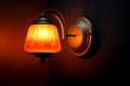 Lamp elegance wallmounted yelloworange shade creates a cozy atmosphere Royalty Free Stock Photo