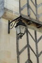 Lamp hanging streetlight in front of old building wall Royalty Free Stock Photo