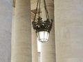 Lamp in colonnade at st.peterssquare in Rome Italy